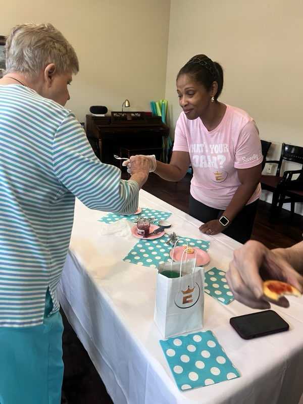Sharing jam at a tasting